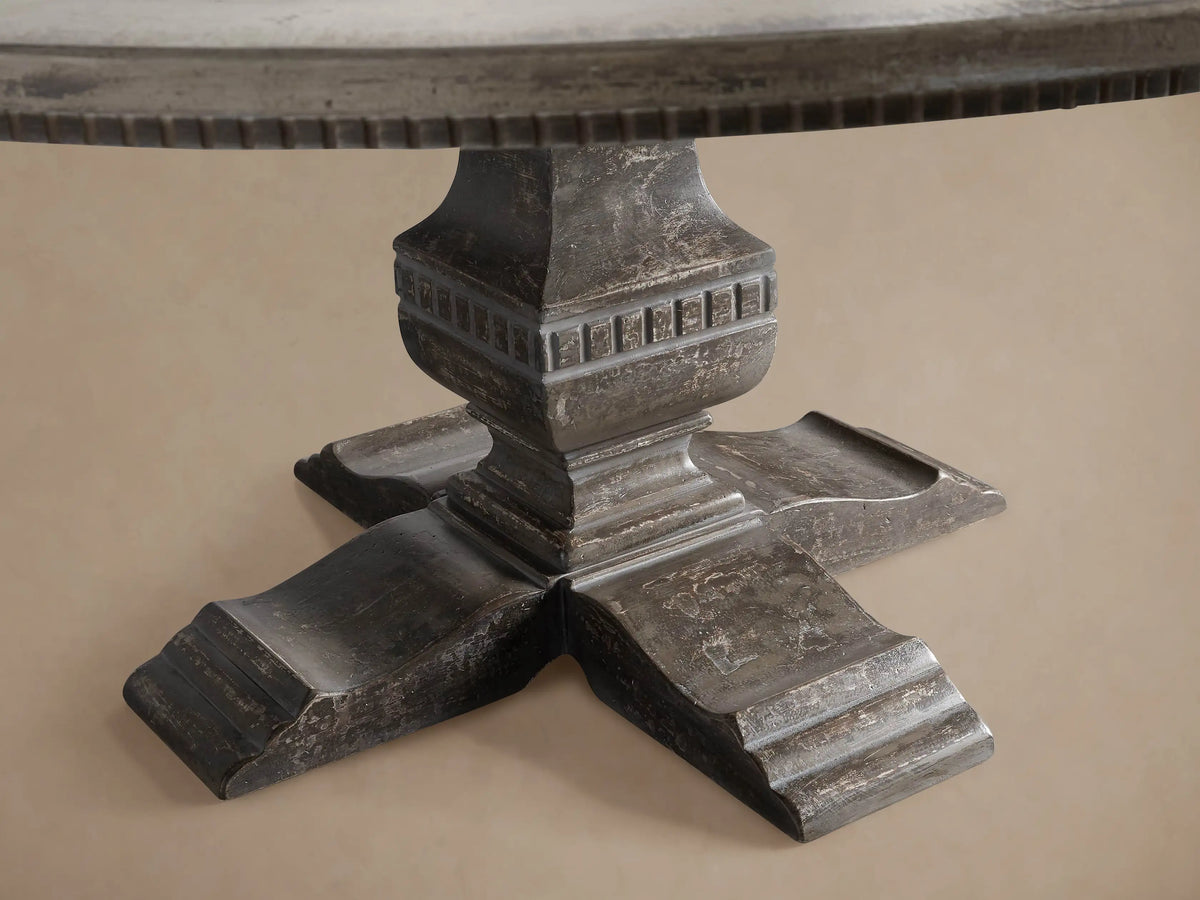 Close-up of Cerea Ribbon Bell'Arte Round Dining Table, showing distressed light top with painted gray ribbon border and grooved edge.
