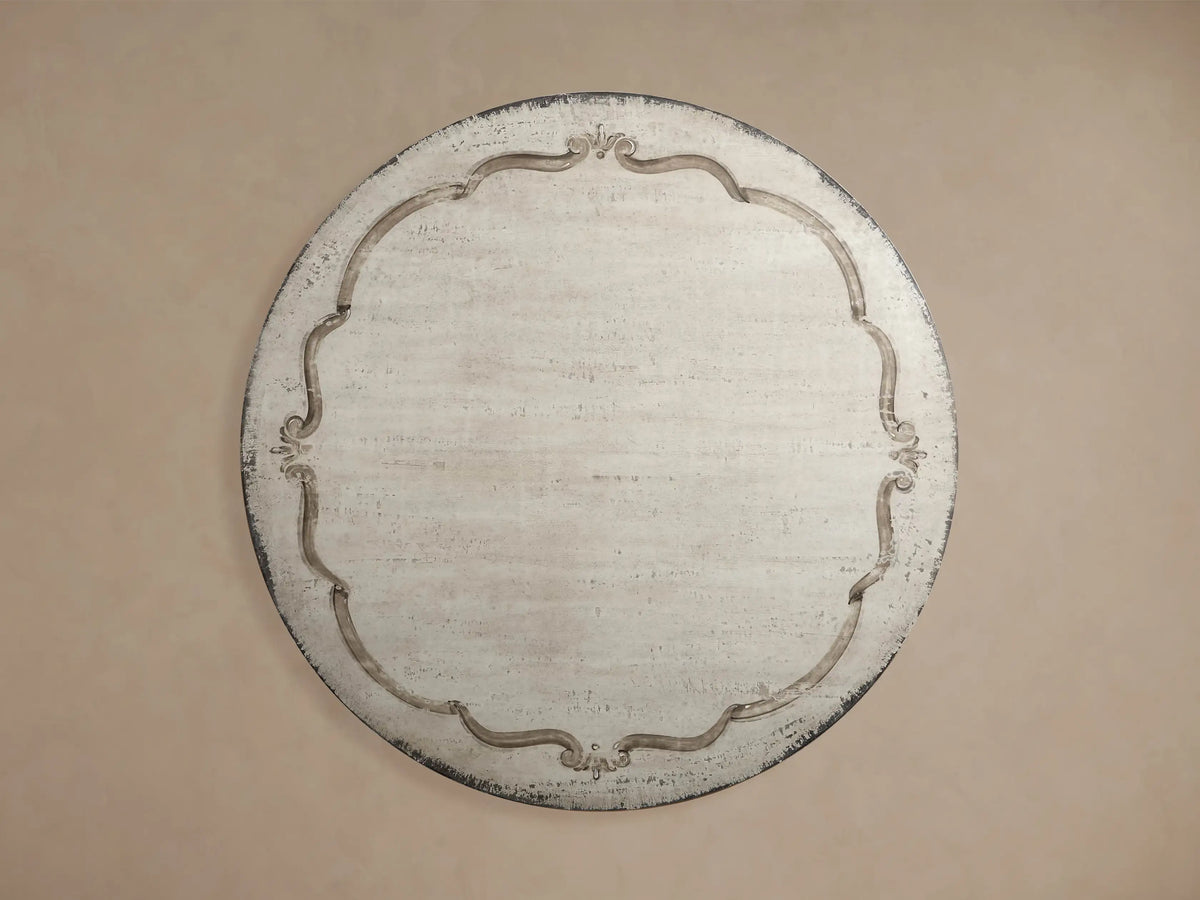Cerea Bell'Arte Round Dining Table base, showing distressed gray-brown pedestal with carved details and ribbed tabletop edge.