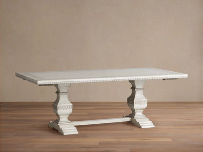 Cerea Margherita Bell'Arte Dining Table, long light distressed wood, two carved pedestal bases, extensions pulled out showing patterned border.