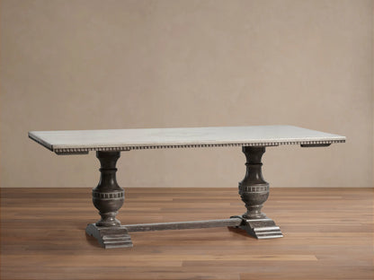 Florence Center Floral Bell‚ÄôArte Dining Table with an Ivory Grey top and dark rust ornate pedestal base on wood floor.
