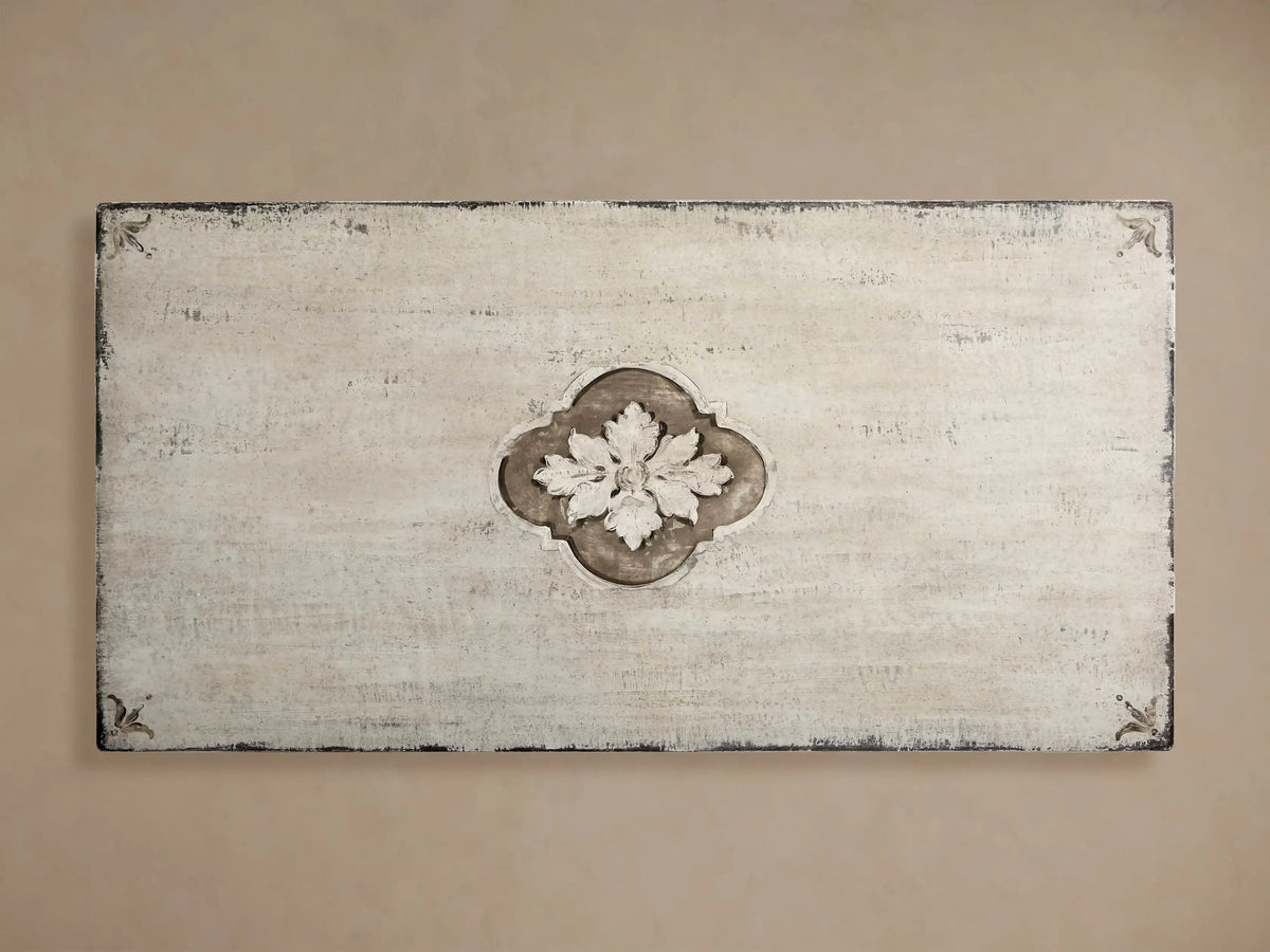 Close-up of Florence Center Floral Bell‚ÄôArte Dining Table's distressed Ivory Grey top with carved edge & Dark Rust floral details.