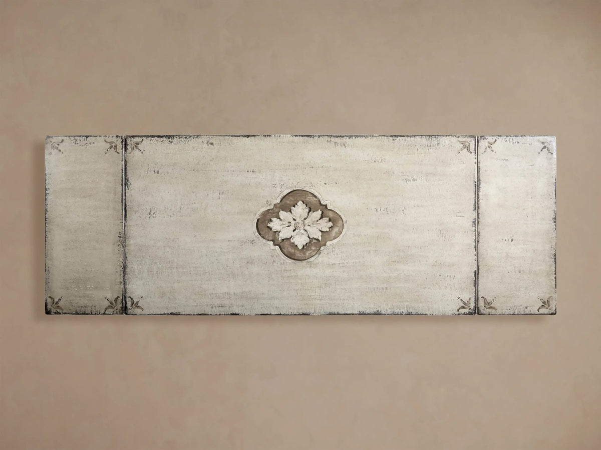 Overhead view of Florence Center Floral Bell‚ÄôArte Dining Table top with distressed ivory-grey finish. Light floral carving on rust-toned quatrefoil.