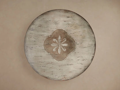 Florence Bell‚ÄôArte Round Dining Table. Distressed ivory grey top with central floral design, dark rust carved pedestal base.