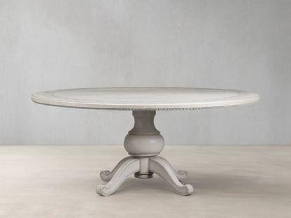 Round Girardi Margherita Bell'Arte dining table in distressed antique white with hand-painted edge pattern and pedestal base.