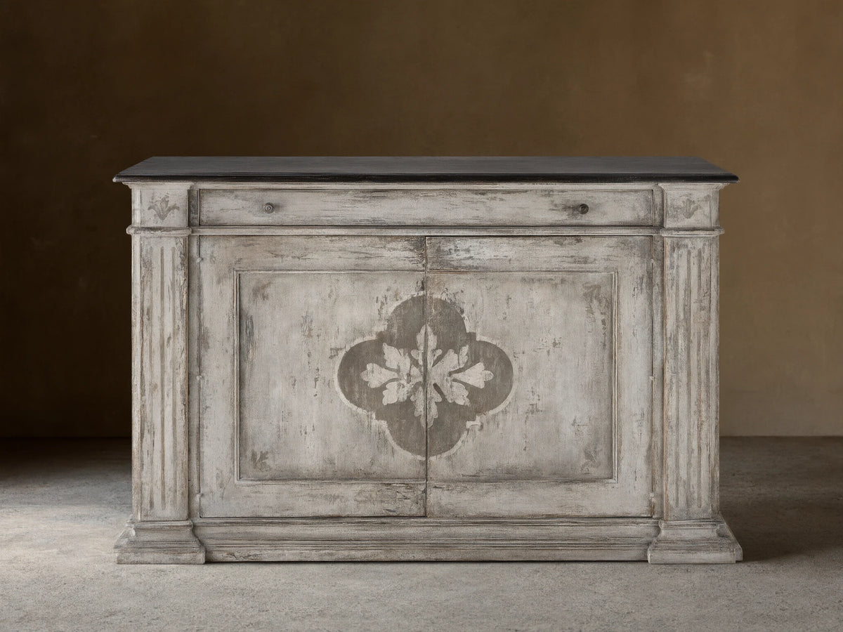 Messina Bell'Arte Buffet: distressed ivory grey cabinet with dark top, two doors with central floral pattern, fluted columns.