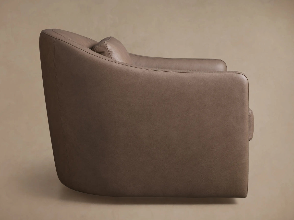 Rear view of the brown leather Bianca Leather Swivel Chair, showing its curved back with a vertical seam.