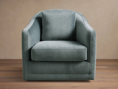 Front view of the Dusty Blue-Green Bianca Swivel Chair with rounded arms, loose seat, and back cushion.