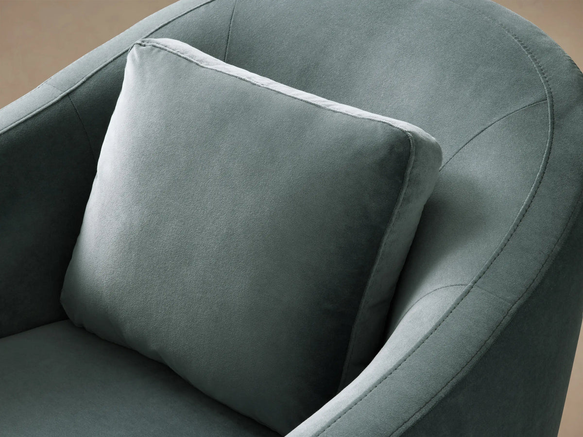 Front view of a muted teal Bianca Swivel Chair, upholstered in soft fabric, with a rounded silhouette and a loose back cushion.