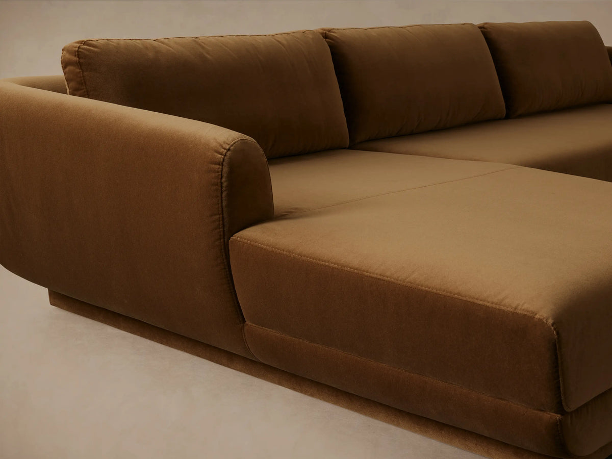 Fontana Two-Piece Chaise Sectional, rich brown velvet, left-facing chaise, modern low profile, on wood floor.