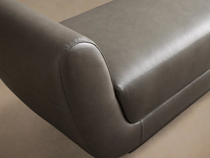 Front view of the ash grey Fontana Leather Bench, with a continuous, curved design and visible seam stitching.