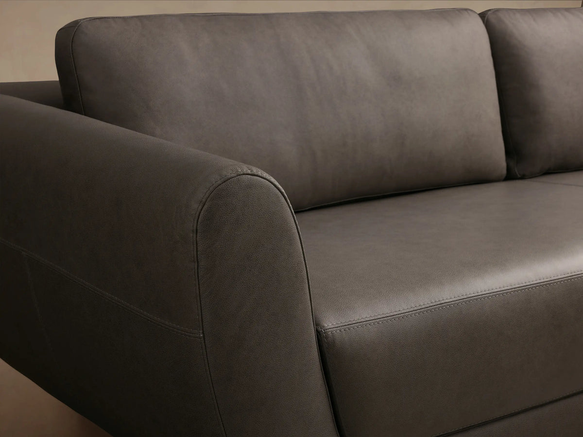 Front view of the dark gray Fontana Leather Sofa, featuring curved arms and two plush seat cushions.