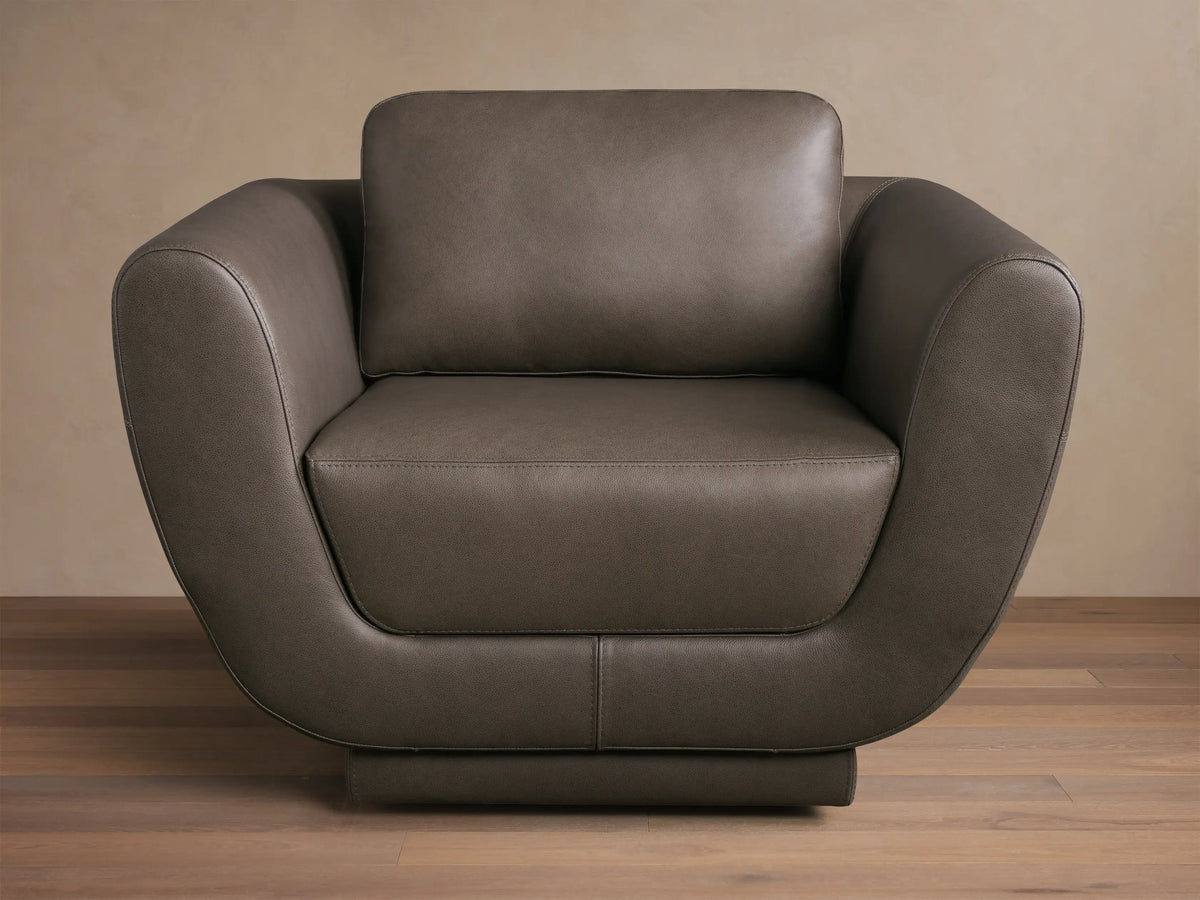 Front view of the Gray Fontana Leather Swivel Chair, featuring a modern design with gently curved arms and distinct cushions.