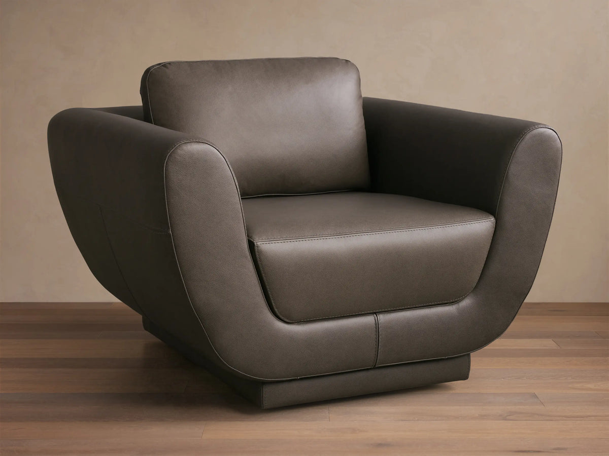 Front view of the Gray Fontana Leather Swivel Chair, featuring a modern design with gently curved arms and distinct cushions.