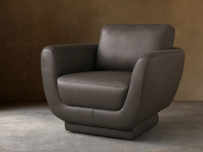 Front view of the Gray Fontana Leather Swivel Chair, featuring a modern design with gently curved arms and distinct cushions.
