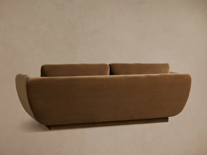 Close-up of the brown Fontana Sofa, showing the soft upholstered armrest, seat, and back cushion.