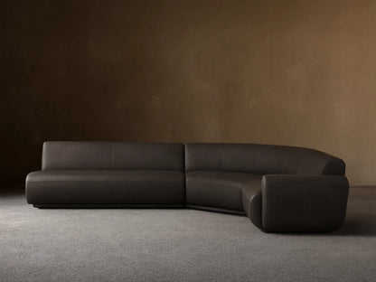 Front view of the dark gray Gianni Leather Three-Piece Sectional with a curved left arm and straight right sections.