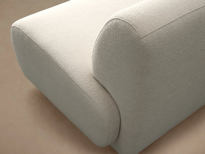 Gianni Armless Four-Piece Chaise Sectional, L-shaped, light cream fabric with soft rounded design, on a wood floor.