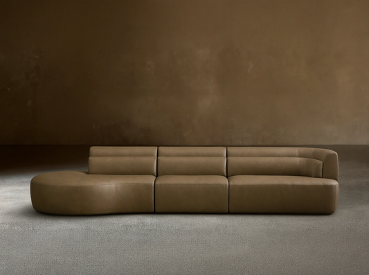 Front view of the taupe Lovina Leather Three-Piece Bumper Sectional, featuring a left bumper chaise, armless chair, and right arm chair.