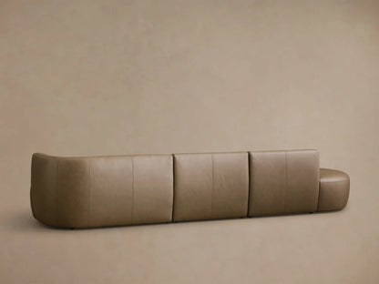 Close-up of the tan leather on the Lovina Leather Three-Piece Bumper Sectional, showing detailed stitching.