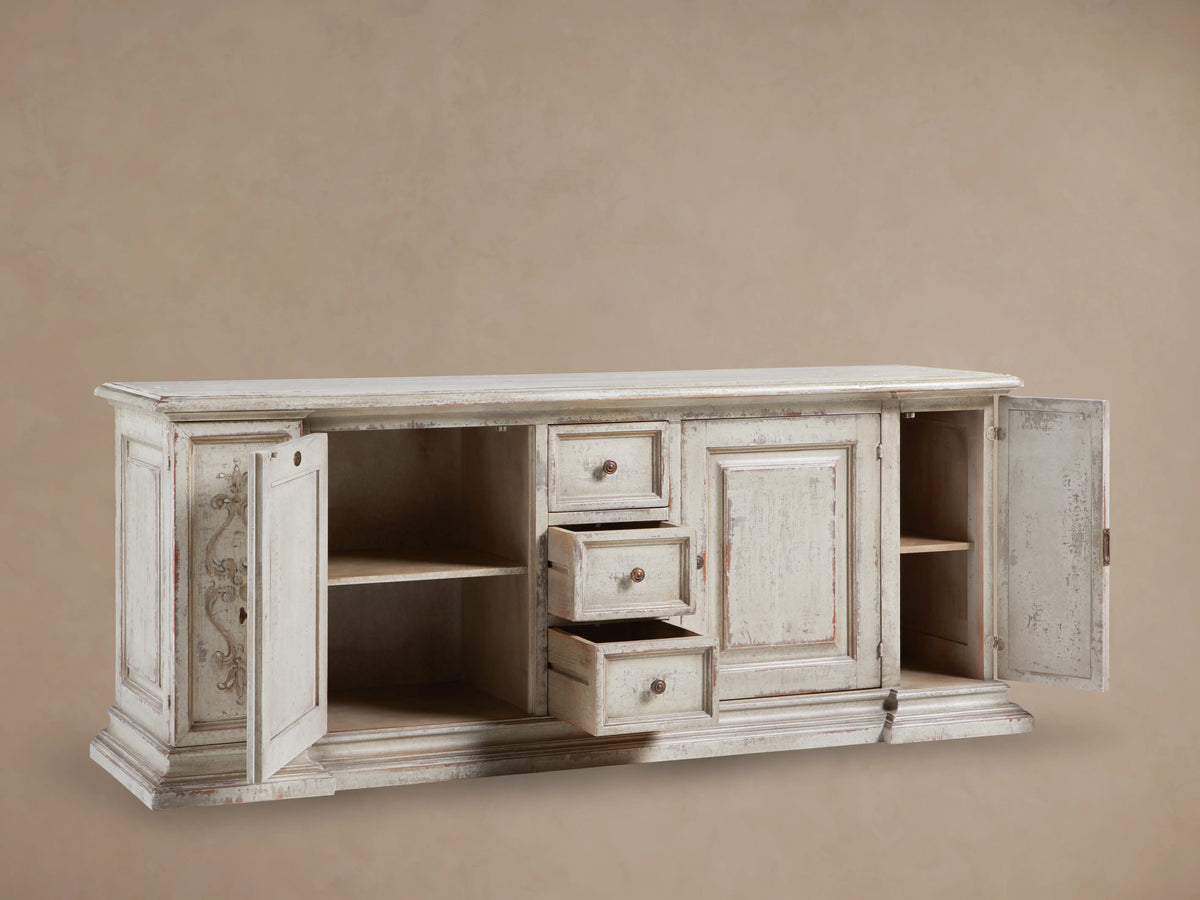 Vittoria Bell'Arte Console in hand-painted Ivory Grey and Dark Rust, featuring ornate carvings, three drawers, and cabinet doors with brass knobs.