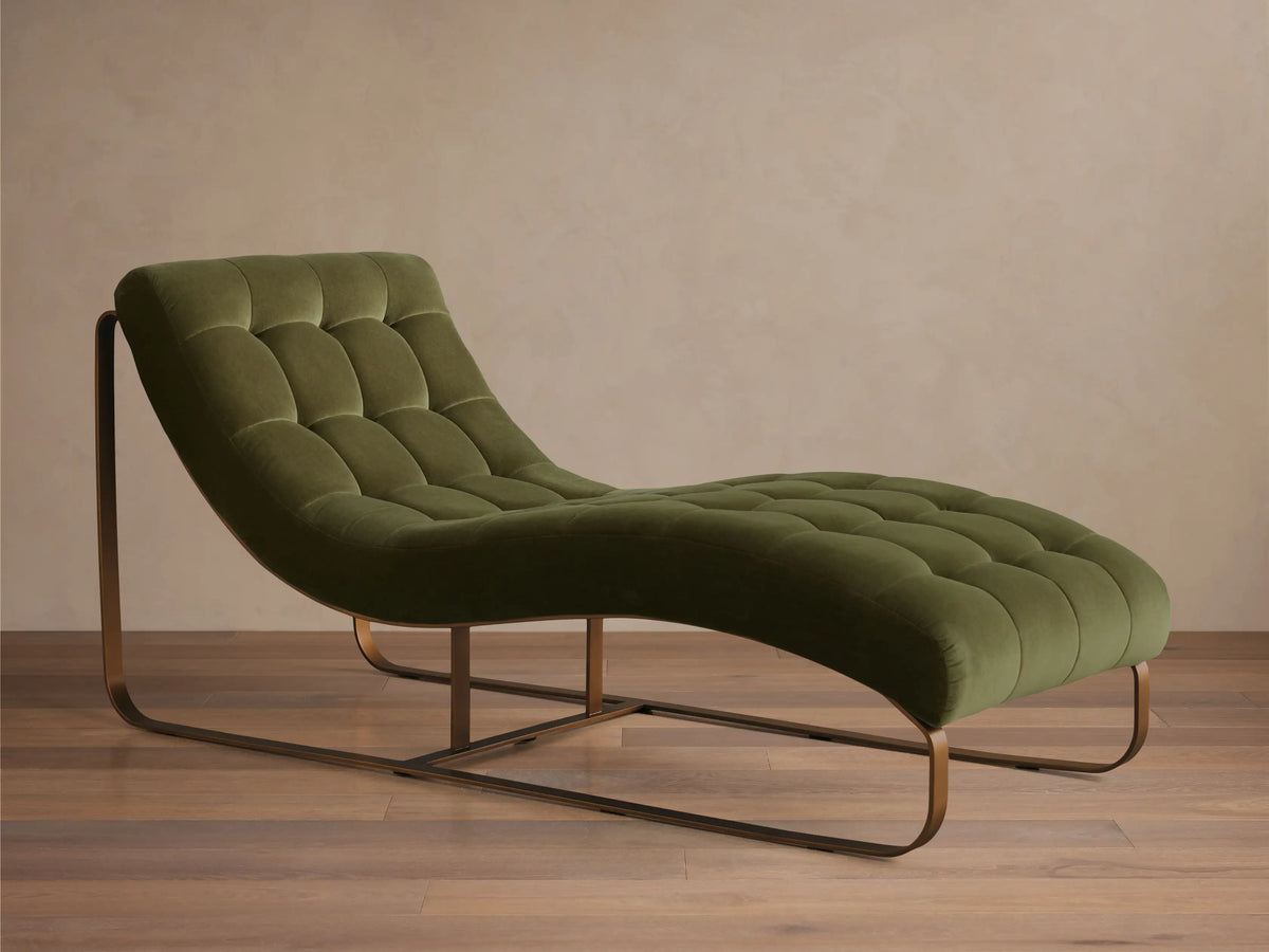 Front view of the olive green tufted velvet Callaway Chaise with a curved bronze metal frame and a long reclined seat.