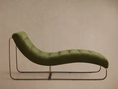 Front view of the olive green tufted velvet Callaway Chaise with a curved bronze metal frame and a long reclined seat.