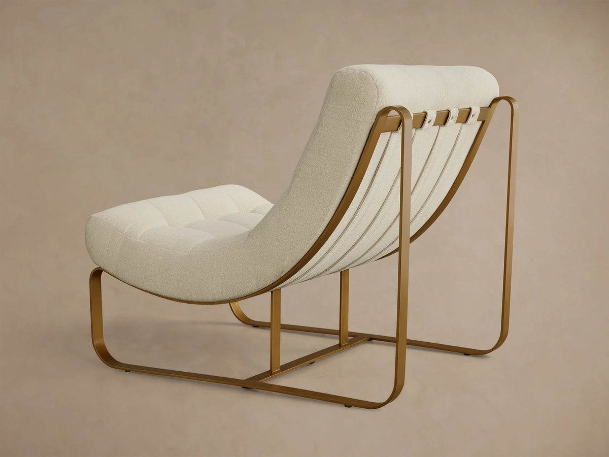 Front view of a cream boucle Callaway Chair with tufted cushions and a curved gold-toned metal frame.