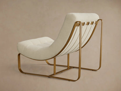 Front view of a cream boucle Callaway Chair with tufted cushions and a curved gold-toned metal frame.