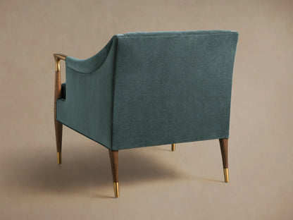 Teal Fisher Club Chair, detailed view of tufted back, coordinating lumbar pillow, brass, and wood armrest.