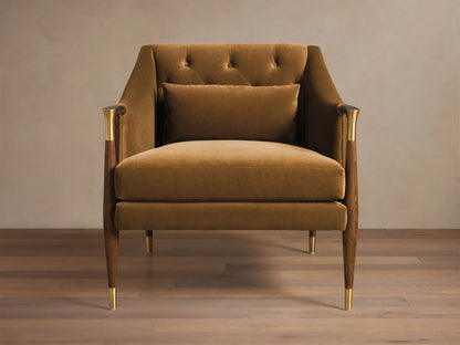 Front view of a golden-brown Fisher Club Chair with velvet upholstery, tufted back, and wooden legs with brass accents.
