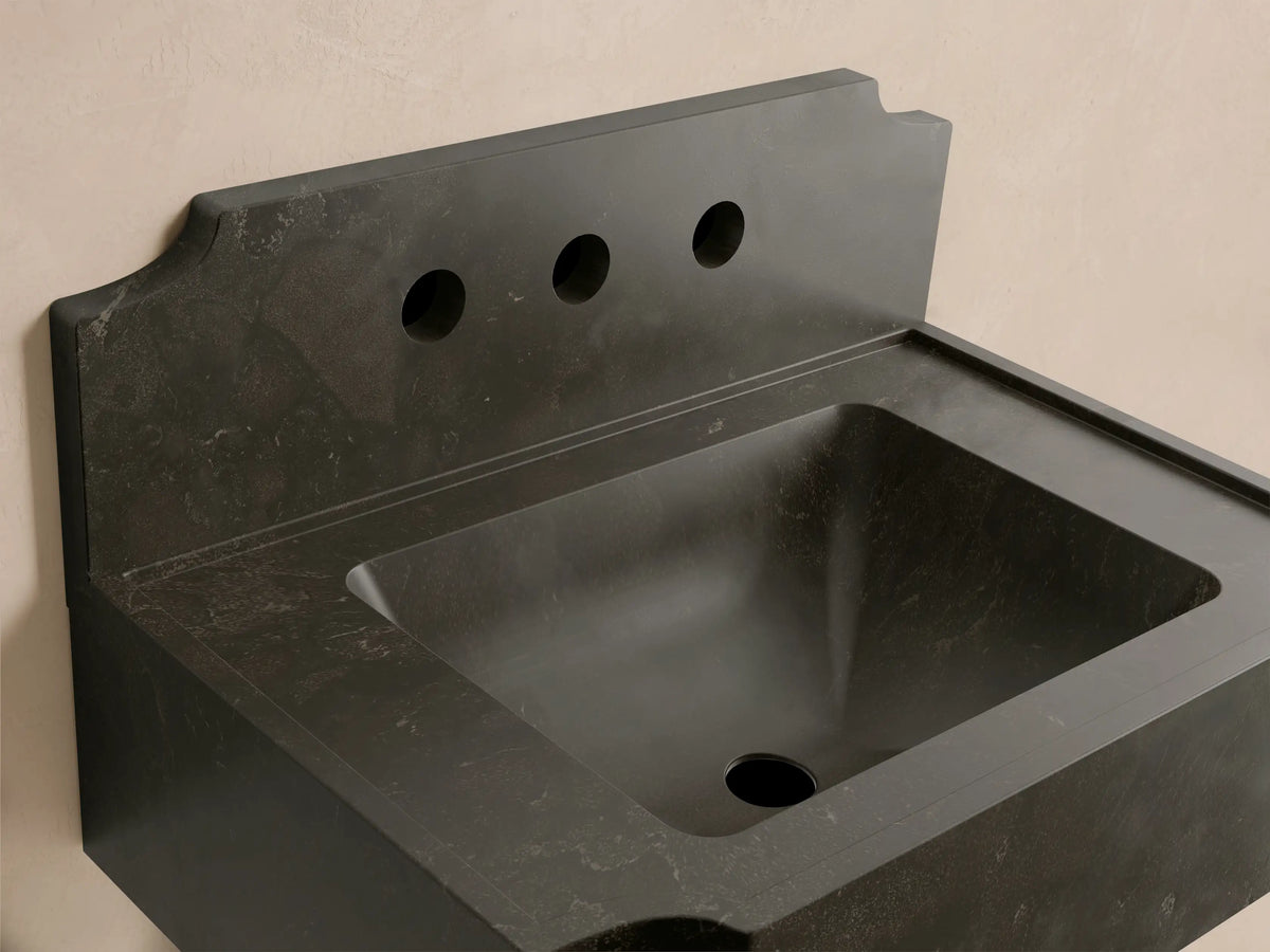 Front view of the dark gray Dottie Wall-Mounted Sink with Backsplash, a solid stone sink featuring three faucet holes.