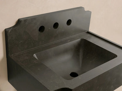 Front view of the dark gray Dottie Wall-Mounted Sink with Backsplash, a solid stone sink featuring three faucet holes.