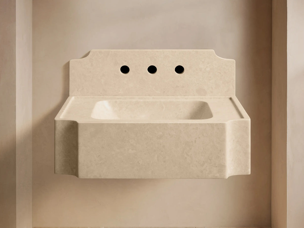 Front view of the light beige Dottie Wall-Mounted Sink with Backsplash, featuring an integrated backsplash and chrome faucet fixtures.