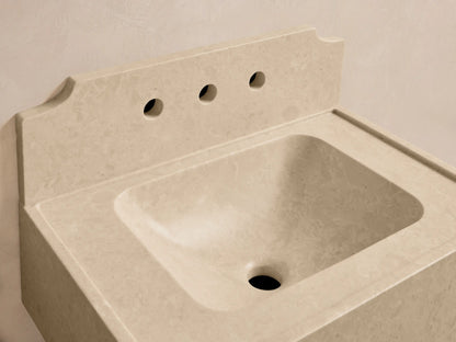 Front view of the cream Dottie Wall-Mounted Sink with Backsplash, made of honed stone with a built-in basin and chrome faucet.