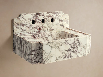 Front view of the white and purple honed marble Dottie Wall-Mounted Sink with Backsplash, with a silver wall-mounted faucet.