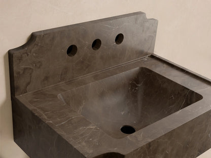 Front view of the dark gray mottled stone Dottie Wall-Mounted Sink with Backsplash, featuring three faucet holes.