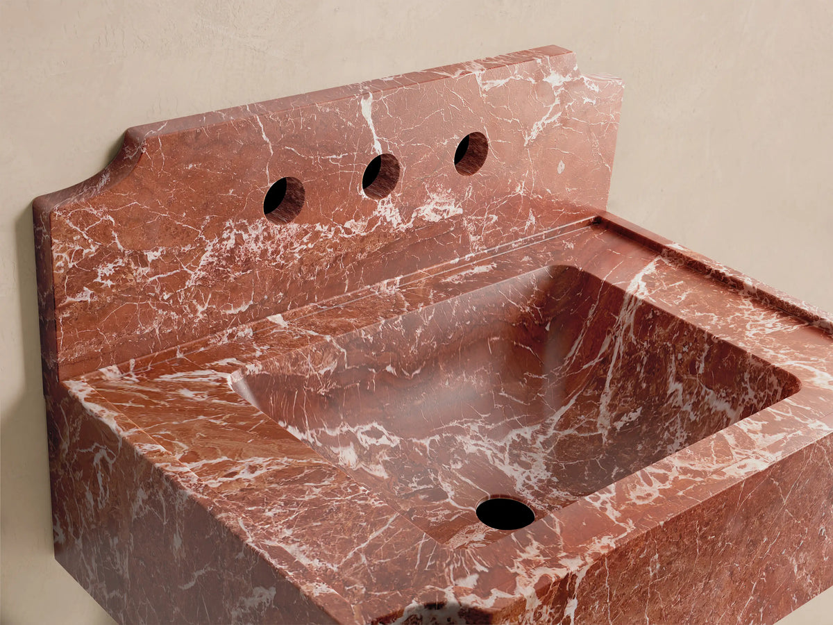 Front view of the red marble Dottie Wall-Mounted Sink with Backsplash, featuring three faucet holes and white veining.