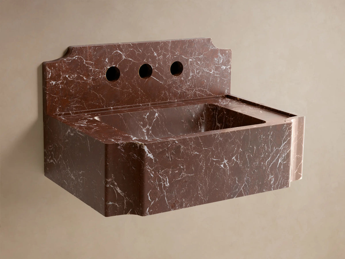 Front view of a reddish-brown marble Dottie Wall-Mounted Sink with Backsplash, with white veining and a chrome wall faucet.