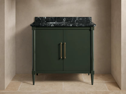 Front view of the dark green Oakleigh Single Vanity with a dark veined marble top, two doors, and gold pull handles.