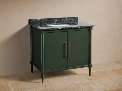 Front view of the dark green Oakleigh Single Vanity with a dark veined marble top, two doors, and gold pull handles.