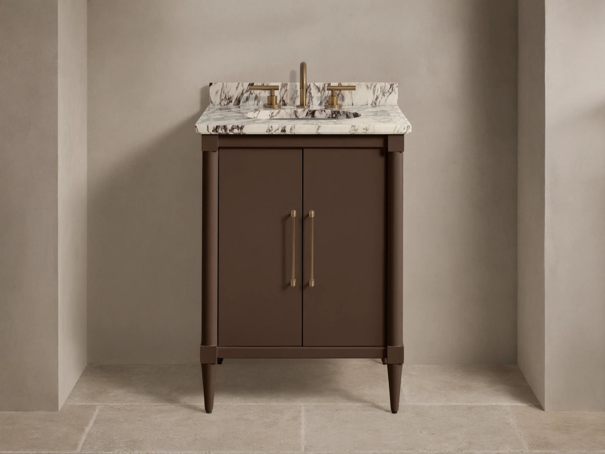 Front view of the dark brown Oakleigh Powder Vanity™ with a white veined marble top, gold faucet, and two brass handles.