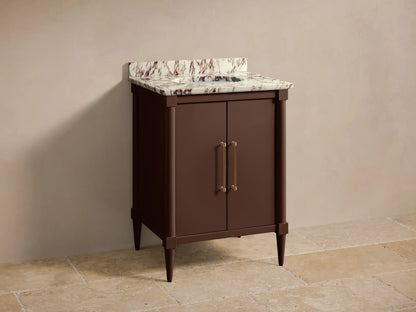 Front view of the dark brown Oakleigh Powder Vanity™ with a white veined marble top, gold faucet, and two brass handles.