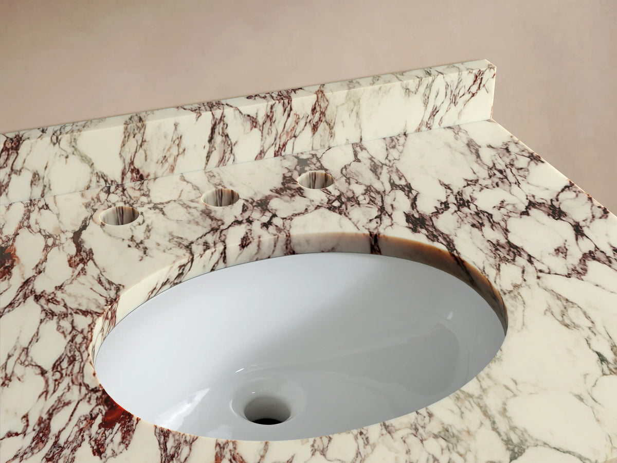 Front view of the dark brown Oakleigh Powder Vanity with a multi-toned marble top, integrated backsplash, gold handles, and tapered legs.