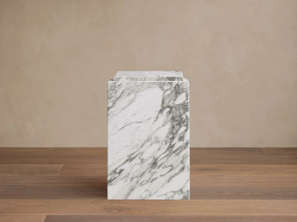 Front view of the white Marmont Pedestal with gray marble veining, a rectangular block design.
