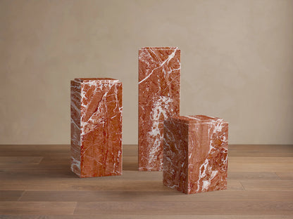 Front view of the reddish-brown natural stone Marmont Pedestal™ with prominent white veining and a matte finish.