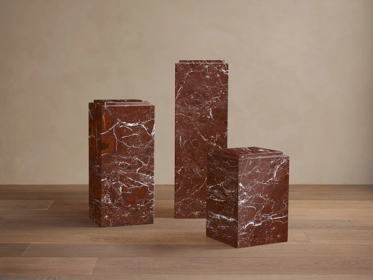 Front view of a Burgundy natural stone Marmont Pedestal, a rectangular pillar with striking white veining.