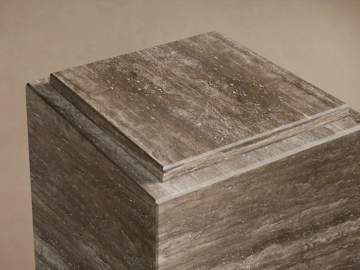 Close-up of the square Marmont Pedestal, showcasing its natural stone with brown and grey veining and stepped top detail.