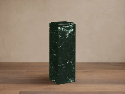 Front view of a dark green marble Marmont Pedestal with striking white veining and a matte finish.