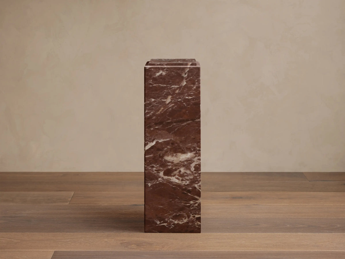 Front view of the reddish-brown marble Marmont Pedestal, featuring natural white and light brown veining.