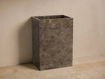 Front view of the dark brown marbled Vertiz Pedestal Sink with Storage, showcasing natural stone veining and a square basin.